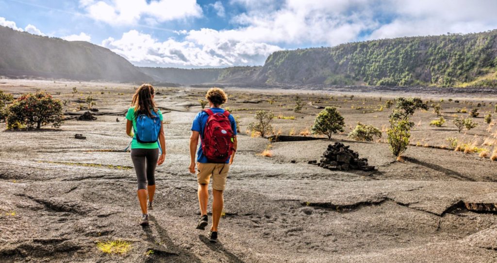 two tourists walking on the Kilauea Iki Crater grounds in the Big Island of Hawaii