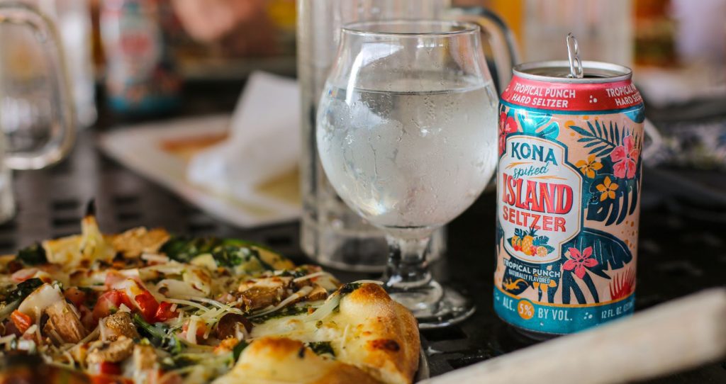 a can of the popular Kona beer served with pizza on the Big Island of Hawaii