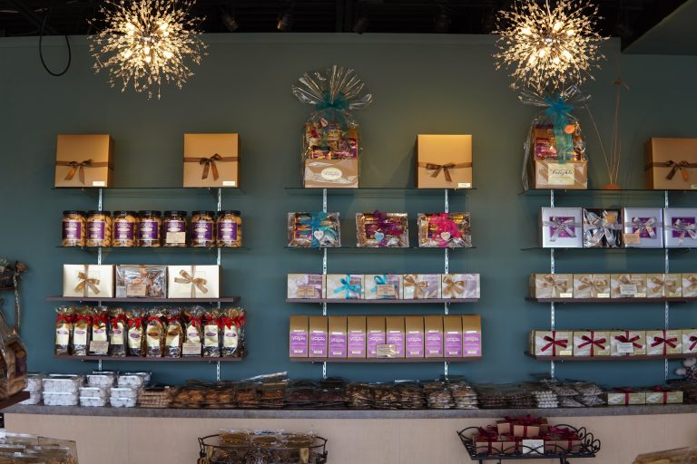 A delightful assortment of mouthwatering treats elegantly presented in a store adorned with serene blue walls.