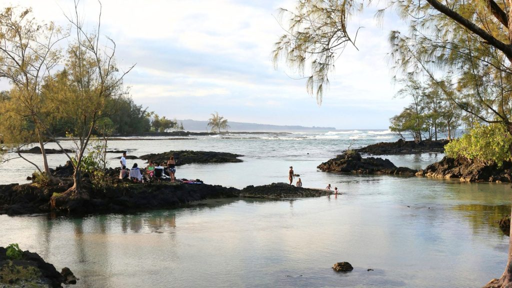People hanging out by the beach under the cool sun