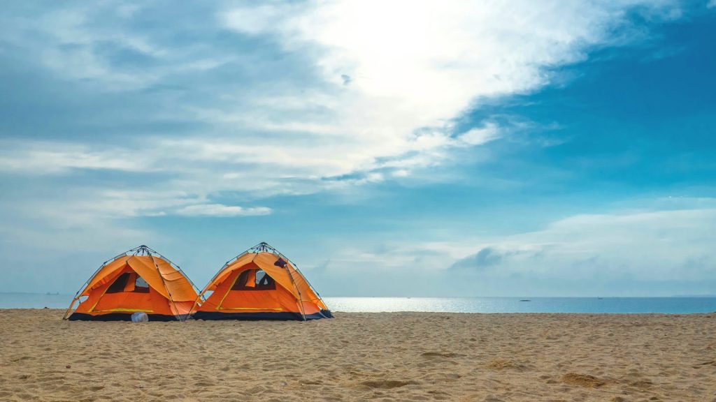 Samuel spencer beach park-2 Orange camping tents set up near the ocean